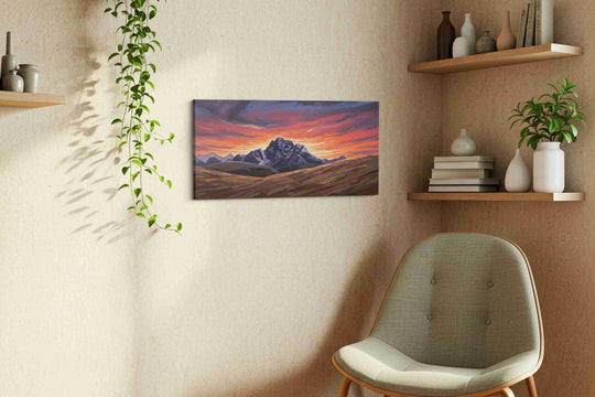 Large mountain landscape canvas hung above a living room sofa