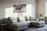 Majestic Winter Stroll animals canvas print, displayed in a living room