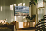 Storm Over Tranquil Shore beach canvas print in a hung canvas mockup