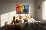 Rainbow Harmony Toucan birds canvas print, displayed in a bedroom