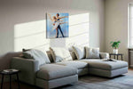 Ethereal Dance in Blue dancing canvas print, displayed in a living room
