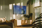 Liberty's Radiant Dawn landmarks canvas print in a contemporary interior mockup