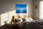 Azure Horizon Reflections ocean canvas print, displayed in a bedroom