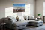Cityscape Symphony in Blue urban canvas print, displayed in a living room