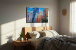 Vibrant Skyscraper Symphony urban canvas print, displayed in a bedroom