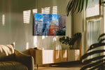 Vibrant Skyscraper Symphony urban canvas print, hanging on wall — in a hung canvas mockup