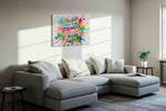 Explosion of Encouragement motivational canvas print styled in a living room