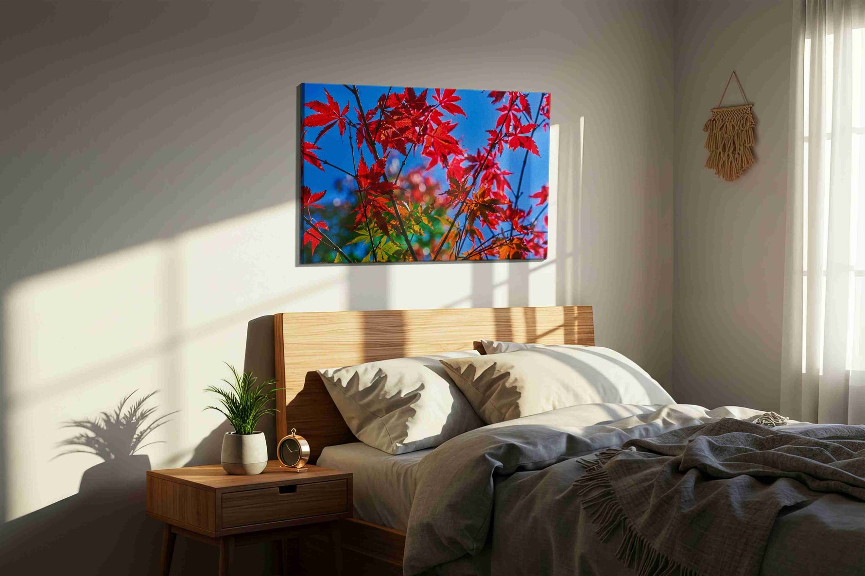 Crimson Canopy leaves canvas print, displayed in a bedroom