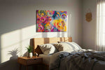 Ebullient Whirl of Blooms floral canvas print, displayed in a bedroom