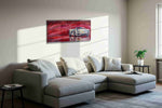 Crimson Velocity automobile canvas print, displayed in a living room