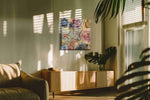 Whisked Away in Culinary Bliss typography canvas print, hanging on wall — in a hung canvas mockup