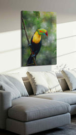 Vivid Jungle Sentinel birds canvas print, displayed in a living room