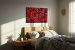 Crimson Petals Symphony floral canvas print, displayed in a bedroom