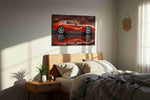 Velocity in Crimson Hues automobile canvas print, displayed in a bedroom