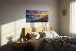 Sunset Symphony on the Shore ocean canvas print, displayed in a bedroom