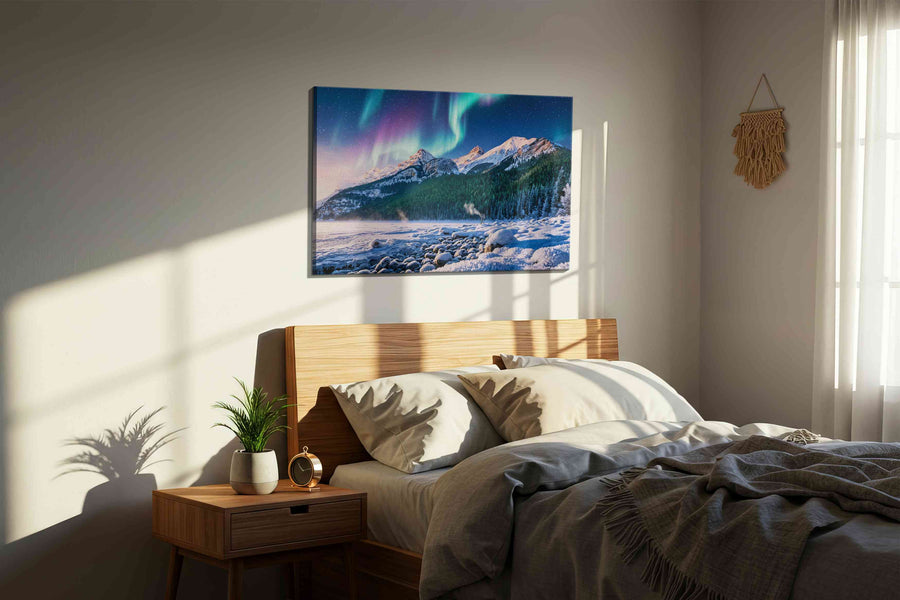 Aurora's Majesty Over Peaks winter canvas print, displayed in a bedroom