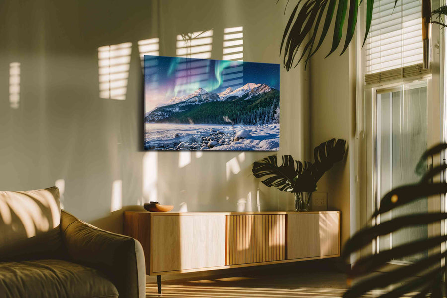 Aurora's Majesty Over Peaks winter canvas print in a hung canvas mockup