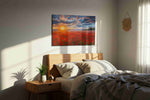 Ember Sky Over Poppies poppies canvas print, displayed in a bedroom
