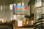 Tangerine Tides at Daybreak beach canvas wall art shown hanging in a styled interior