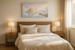 Rainbow Reverie Isles fantasy canvas wall art displayed above a bed in a styled bedroom scene