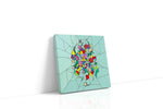 Prismatic Rose Reverie canvas wall art displayed above a sofa in a modern living room