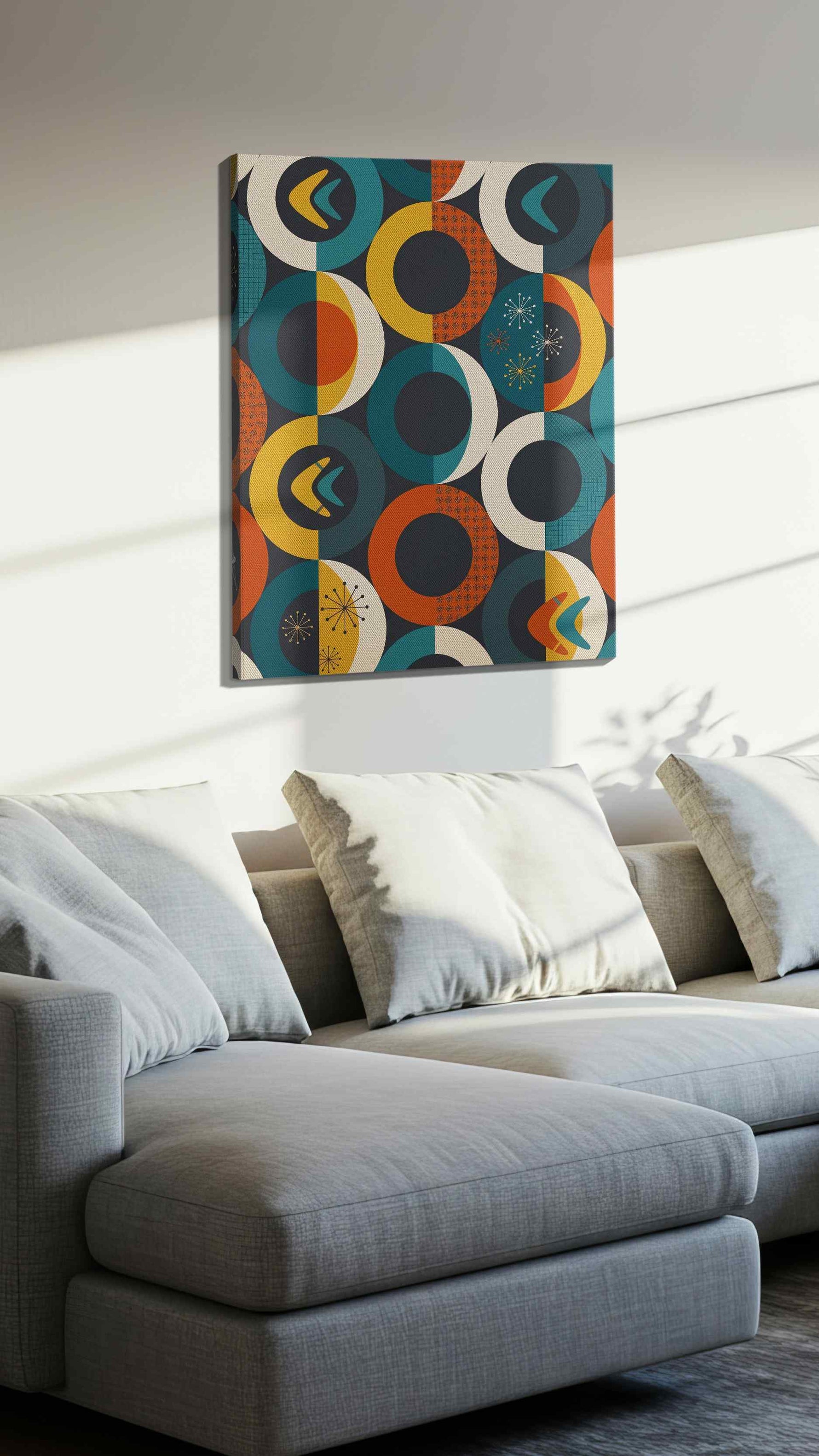 Atomic Eclipse Reverie geometric canvas wall art displayed above a sofa in a styled living room scene