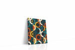 Atomic Eclipse Reverie geometric canvas wall art displayed above a sofa in a modern living room