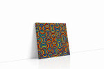 Prismatic Echo Arches geometric canvas wall art displayed above a sofa in a modern living room