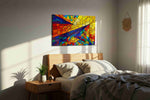 Solar Prism Rhapsody geometric canvas wall art displayed above a bed in a styled bedroom scene