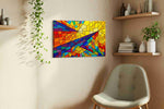 Solar Prism Rhapsody geometric canvas wall art displayed above a bed in a contemporary bedroom