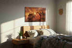 Emberlight Over Rouen Square landmark canvas wall art displayed above a bed in a styled bedroom scene
