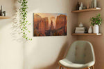 Moonrise Through Cathedral Spires landmark canvas wall art displayed above a bed in a contemporary bedroom