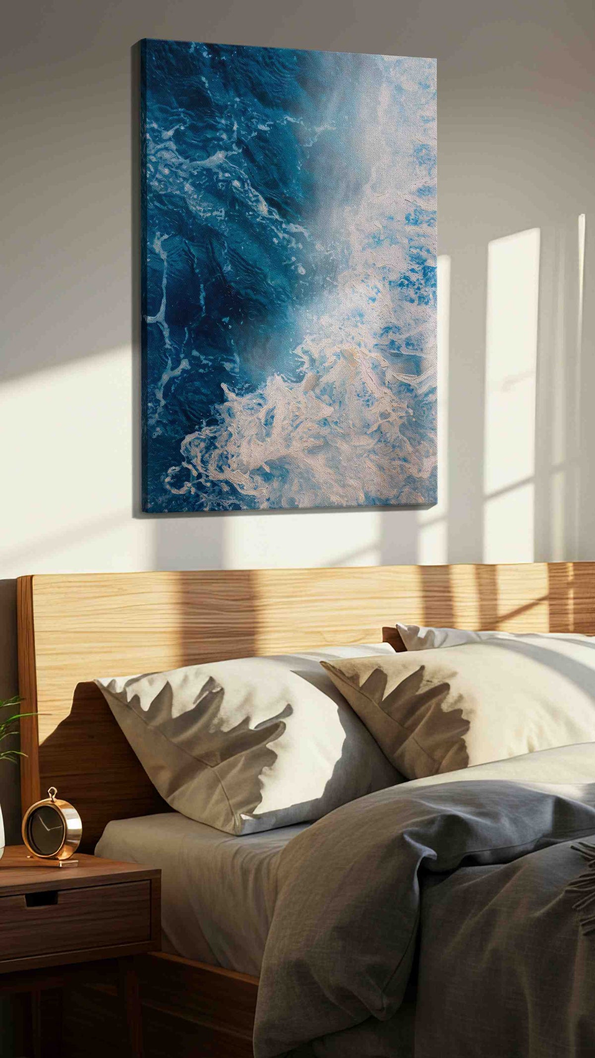 Where Foam Meets Midnight coastal canvas wall art displayed above a bed in a styled bedroom scene
