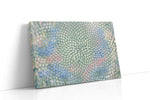 Pastel Bloom Vortex sunflower canvas wall art displayed above a sofa in a modern living room