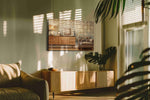 Broadcasts in Amber Light vintage canvas wall art displayed above a bed in a contemporary bedroom